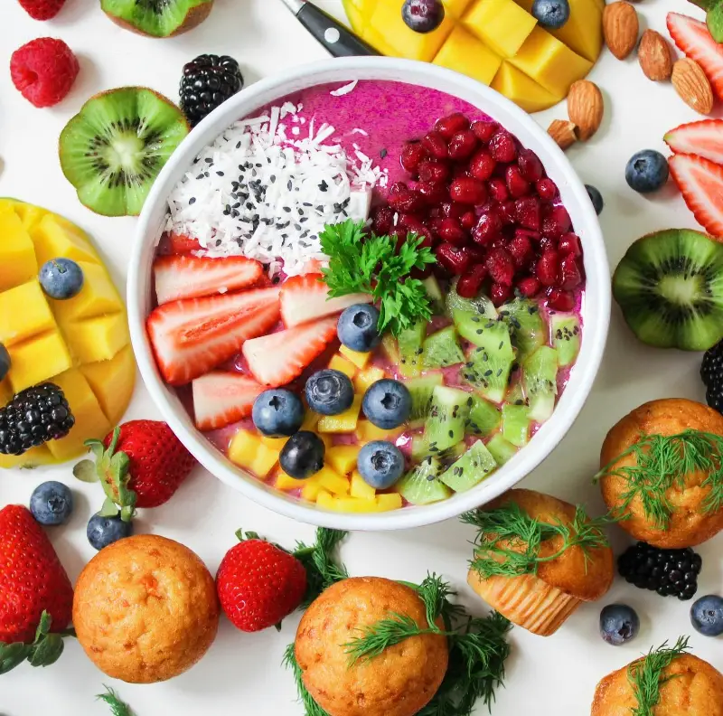 Assorted Sliced Fruits in White Ceramic Bowl